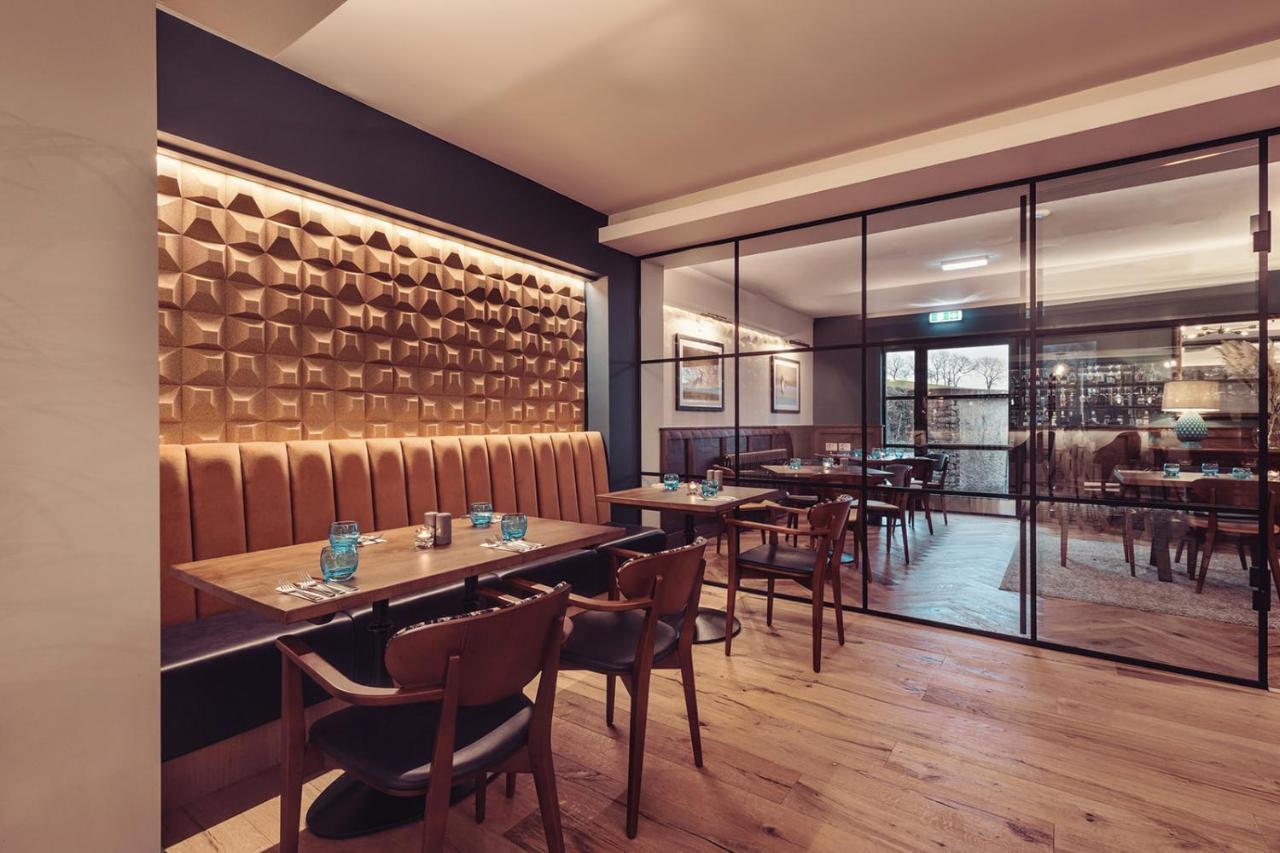 فندق لونغلاندس إن آند كوتيدجيز كارنفورث المظهر الخارجي الصورة Interior of the restaurant